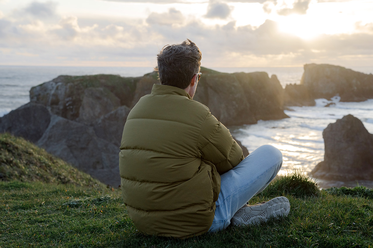 Man sitting at ocean Bandon Oregon by Snow Peak USA