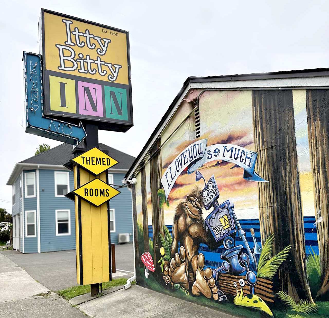Highway Sign and Mural at the Itty Bitty Inn in North Bend, Oregon